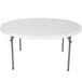 A white round Lifetime folding table with metal legs.