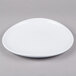 A white Elite Global Solutions melamine plate with a spiral design.