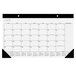 A white At-A-Glance desk pad calendar with black numbers and lines.