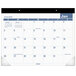 An At-A-Glance desk pad calendar with a blue and white design.
