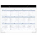 A white At-A-Glance desk pad calendar with blue numbers and lines.