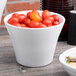 A white Elite Global Solutions medium crock filled with cherry tomatoes.