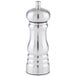 A silver stainless steel pepper mill with a lid.