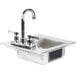 A close-up of a silver Advance Tabco stainless steel sink with a faucet.