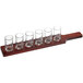 An Acopa mahogany flight paddle with six straight up tasting glasses on it.