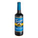 A Torani 750 mL glass bottle of sugar-free chocolate syrup with a blue label.