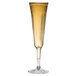 A WNA Comet clear plastic champagne flute.