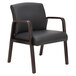 A black Alera reception chair with wooden arms and legs.