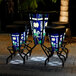A table with Holland Bar Stool Notre Dame University LED bar stools on an outdoor patio.