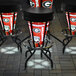 A set of University of Georgia LED bar stools on an outdoor patio.