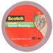 A roll of 3M Scotch black outdoor mounting tape with blue and white text on the label.