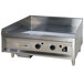 An Anets stainless steel countertop griddle with thermostatic controls and knobs.