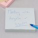 A 3M Post-It note pad with writing on a white sheet of paper and a blue pen.