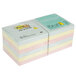 A fan-folded stack of 3M Post-It notes in assorted pastel colors.