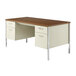 A cherry and putty double pedestal steel desk with a white surface and drawers.