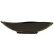 A close up of a black bowl with a curved edge.