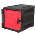 A black Metro Mightylite front loading insulated food pan carrier with red door.