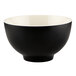 An Elite Global Solutions Karma melamine bowl with a black exterior and white interior.