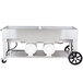 A large stainless steel Crown Verity outdoor grill with two horizontal propane tanks.