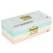 A stack of 3M Post-It notes in assorted pastel colors.