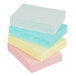 A stack of several different colored 3M Post-It notes.