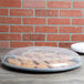 A Fineline black plastic catering tray with cookies in it.