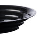 A close up of a black Fineline low profile catering bowl.