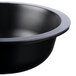 A close up of a black Fineline ReForm low profile serving bowl with a black rim.
