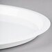 A close up of a Fineline white high rim plastic catering tray.