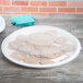 A white plastic catering tray with cookies on it.