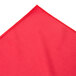 A red table skirt with a stitched edge on a white background.