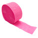 A roll of Creative Converting hot magenta pink streamer paper.