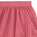 A Snap Drape Wyndham dusty rose table skirt with ruffles.