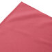 A dusty rose Snap Drape shirred pleat table skirt on a table with velcro clips.