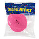 A plastic package containing a roll of candy pink paper streamer.
