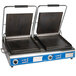 A Globe Deluxe Double Panini Grill with black rectangular panels and metal grill plates.