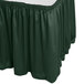 A jade green Snap Drape table skirt with shirred pleats on a table.