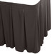 A charcoal Snap Drape table skirt with pleats.