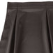 A charcoal Snap Drape Wyndham table skirt with continuous pleats.