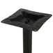 A BFM Seating black metal counter height table base with a square pole and base.