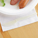 A plate with sausages and an Eco-Products plant starch knife.