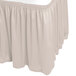 A silver cloud table skirt with a shirred pleat design.