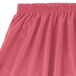A Snap Drape dusty rose table skirt with shirred pleats and velcro clips.