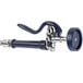 A T&S wall mounted workboard faucet with a blue and silver spray nozzle.