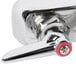 A T&S chrome wall mounted faucet with red handles.