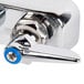 A T&S chrome wall mounted workboard faucet with blue and white handles.