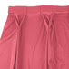 A Snap Drape Wyndham dusty rose table skirt with bow tie pleats.