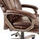 A brown leather Alera Veon series office chair with a metal base.