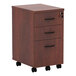 A medium cherry wooden Alera three-drawer mobile file cabinet.
