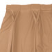 A Snap Drape Wyndham sandalwood table skirt with bow tie pleats.